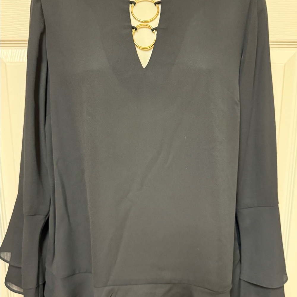 Elegant Black Women's Top with Gold Accents
Small spot on back of right sleeveve
